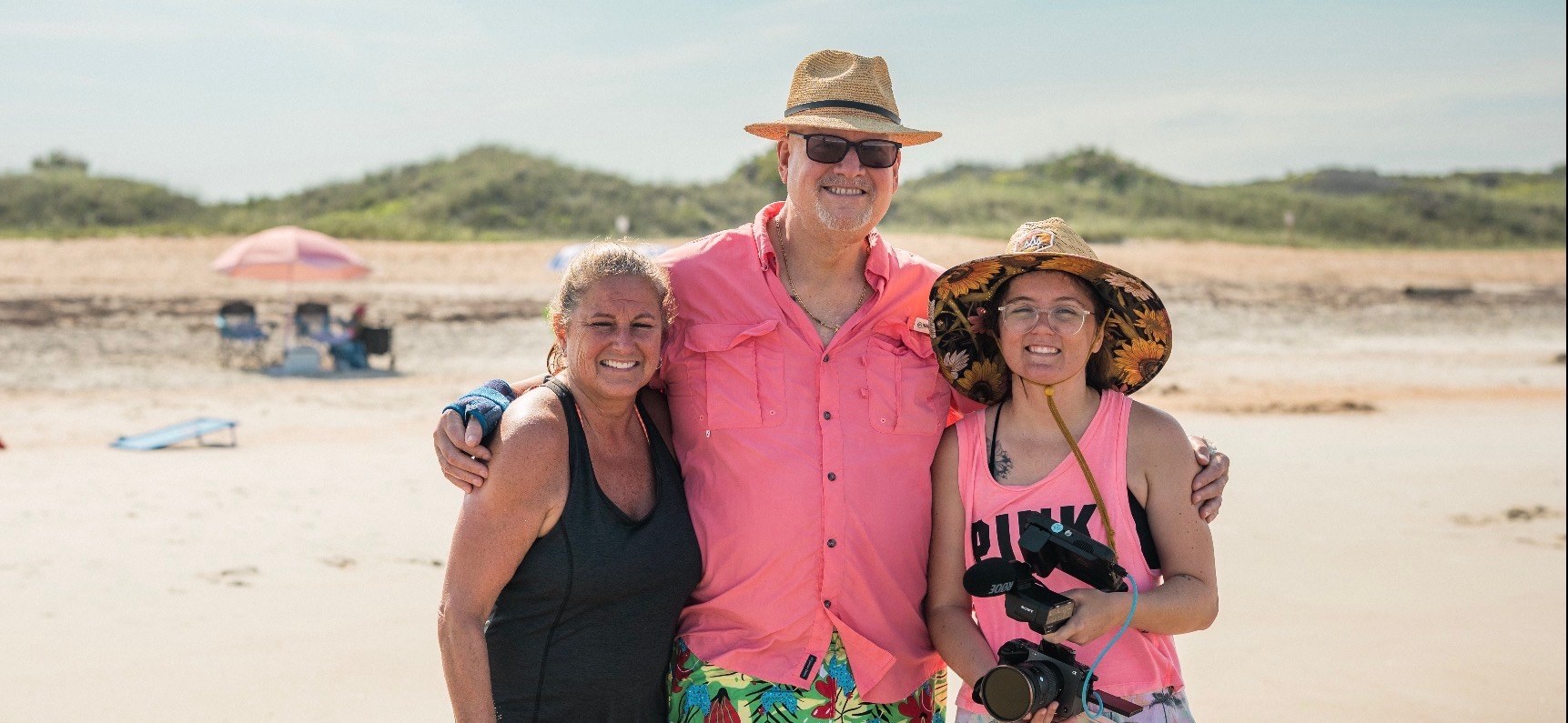 Rob Chumbook with two Lone Warrior Foundation supporters at a beach event